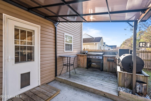 wooden deck featuring area for grilling