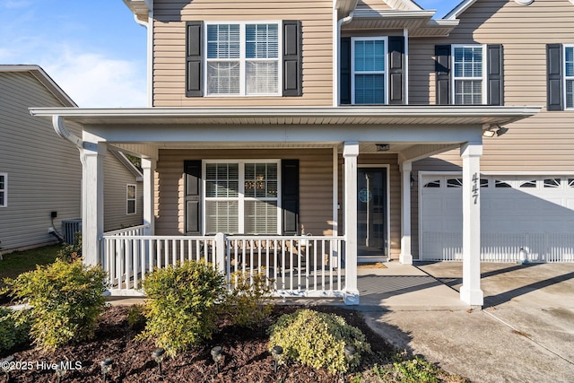 view of front of house with a garage and covered porch