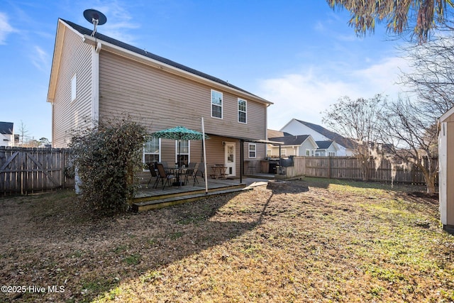 back of house with a wooden deck