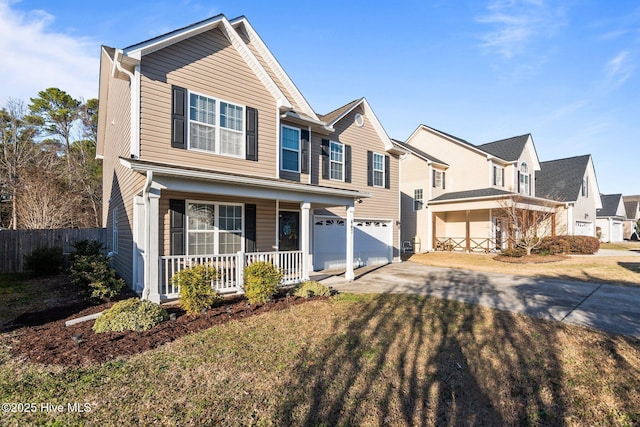 view of front of property featuring a porch, a garage, and a front yard