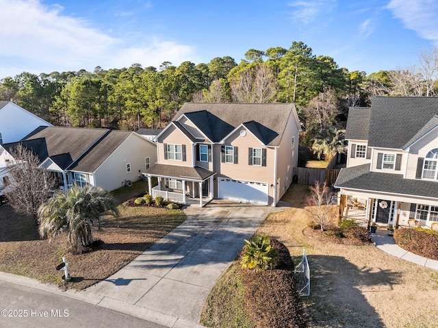 view of front of property with a garage and covered porch