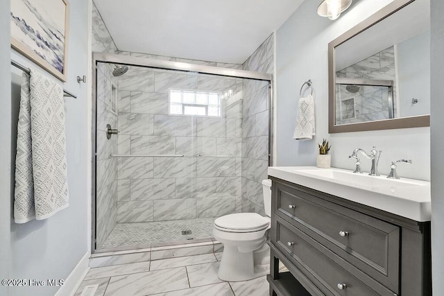 bathroom featuring vanity, toilet, and an enclosed shower