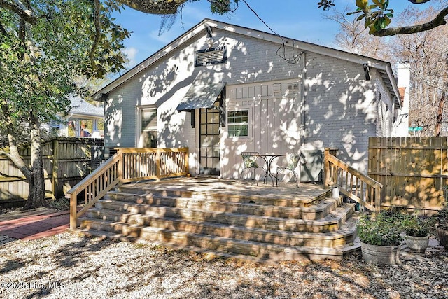 back of house featuring a deck