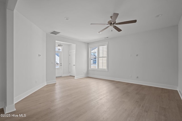 empty room featuring ceiling fan and light wood-type flooring