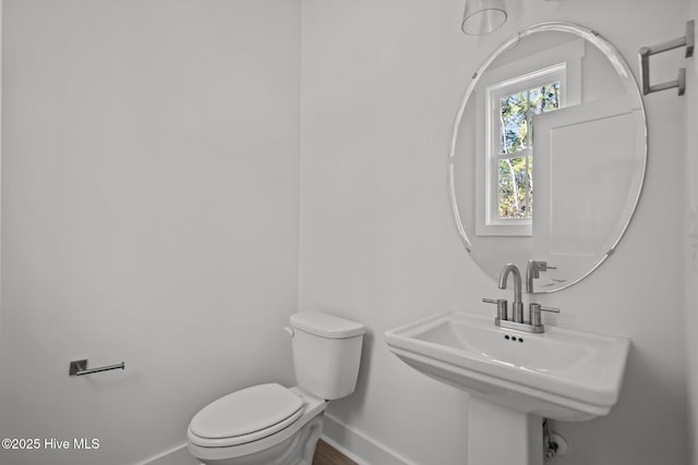 bathroom with sink and toilet