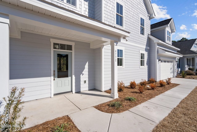 view of exterior entry featuring a garage