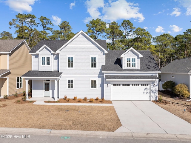 view of front of house with a porch and a garage