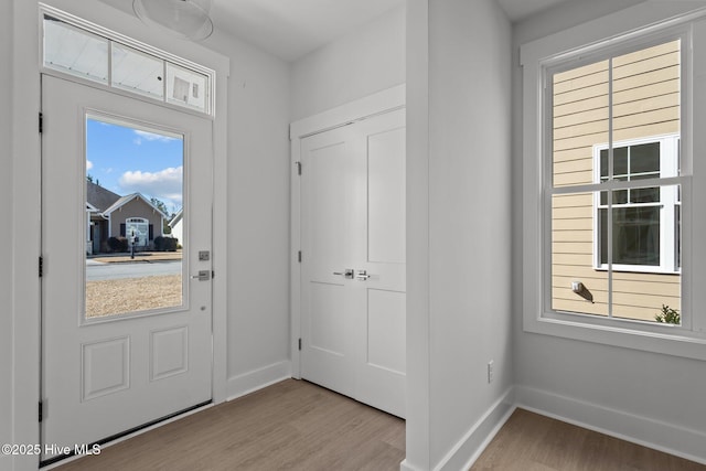 entryway with light hardwood / wood-style floors