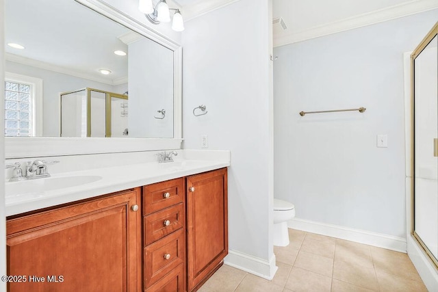 bathroom featuring tile patterned flooring, crown molding, a shower with door, and toilet