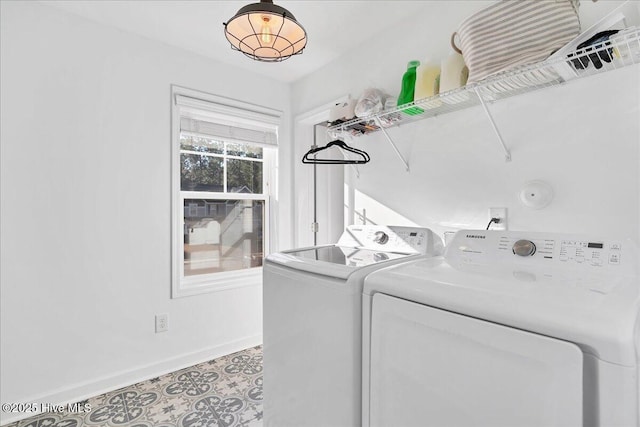 clothes washing area with independent washer and dryer