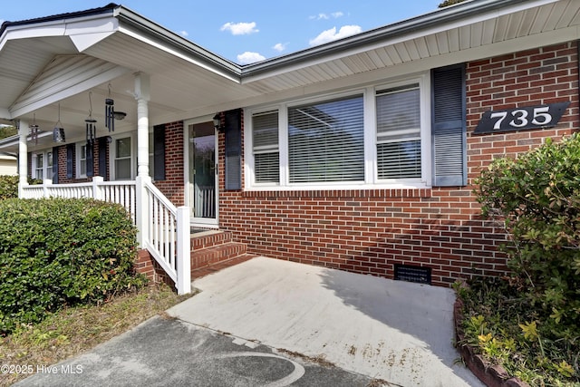 doorway to property with a porch