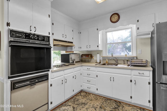 kitchen with white cabinetry, white appliances, plenty of natural light, and sink