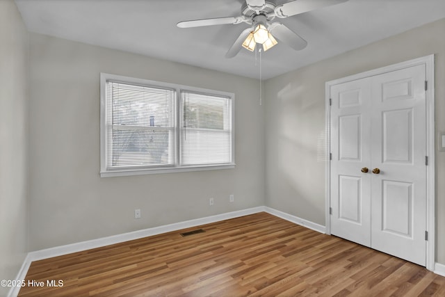 spare room with ceiling fan and light hardwood / wood-style floors