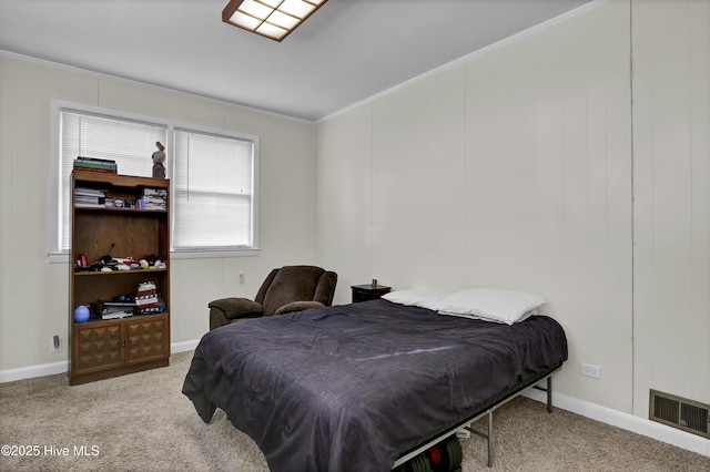 carpeted bedroom with ornamental molding