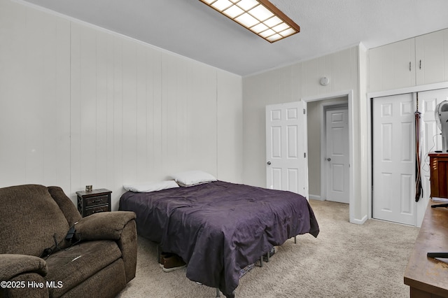 bedroom featuring light carpet