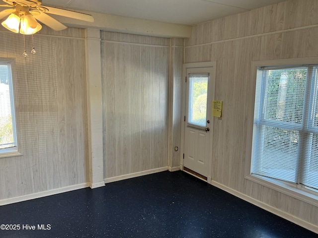 interior space with ceiling fan and a healthy amount of sunlight