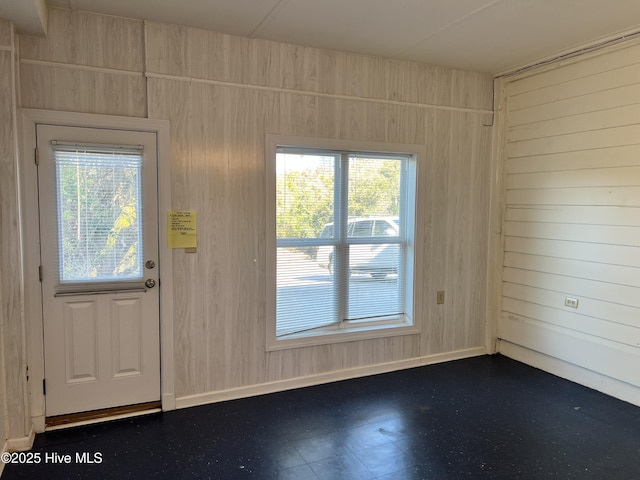 doorway with wooden walls