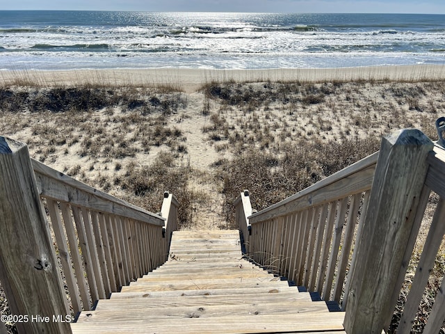 view of water feature with a beach view