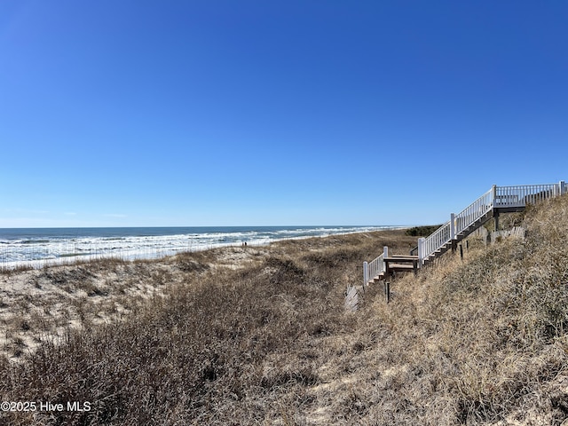 view of water feature with a beach view