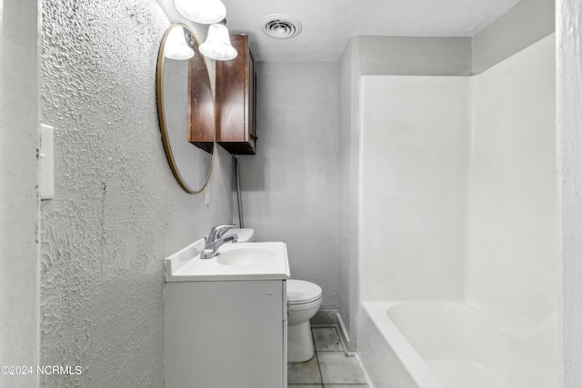 full bathroom with a textured wall, toilet, vanity, visible vents, and tile patterned floors