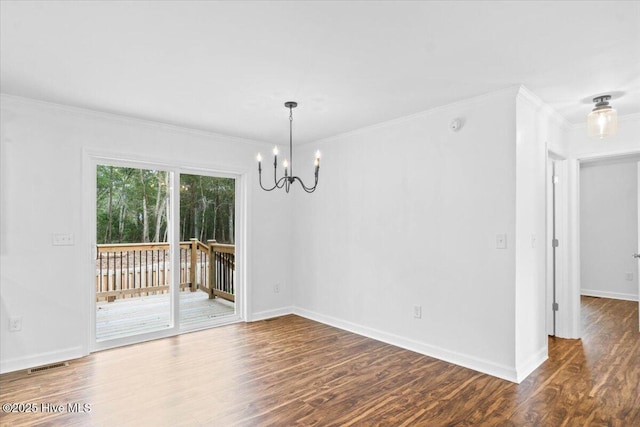 unfurnished dining area with ornamental molding, an inviting chandelier, and dark hardwood / wood-style flooring