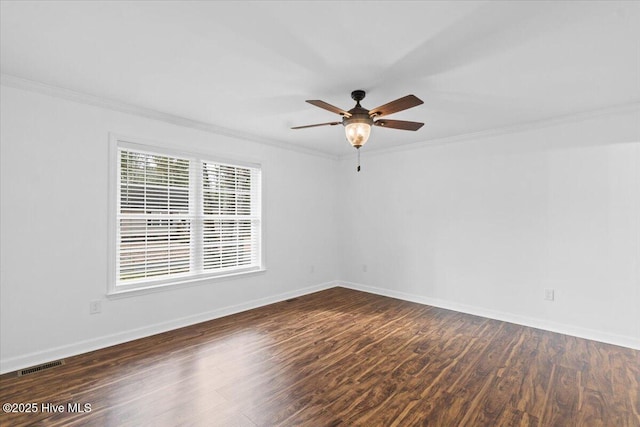 empty room with dark wood-type flooring, ceiling fan, and ornamental molding