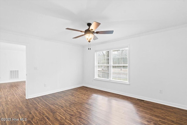 unfurnished room featuring dark wood-type flooring, ornamental molding, and ceiling fan