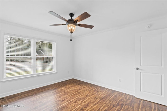 unfurnished room with dark wood-type flooring, ornamental molding, and ceiling fan