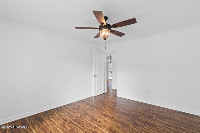 spare room with crown molding, ceiling fan, and dark hardwood / wood-style floors