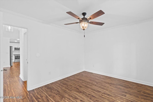 unfurnished room with crown molding, ceiling fan, and dark hardwood / wood-style floors