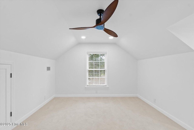 bonus room featuring ceiling fan, light colored carpet, and vaulted ceiling