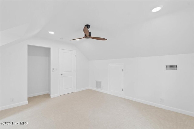 bonus room featuring vaulted ceiling, light colored carpet, and ceiling fan