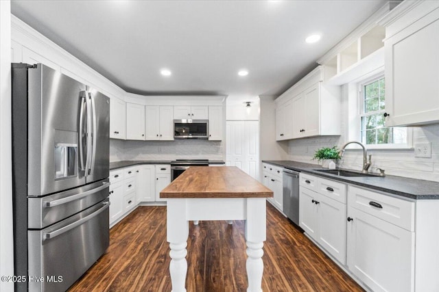 kitchen featuring white cabinetry, appliances with stainless steel finishes, and sink