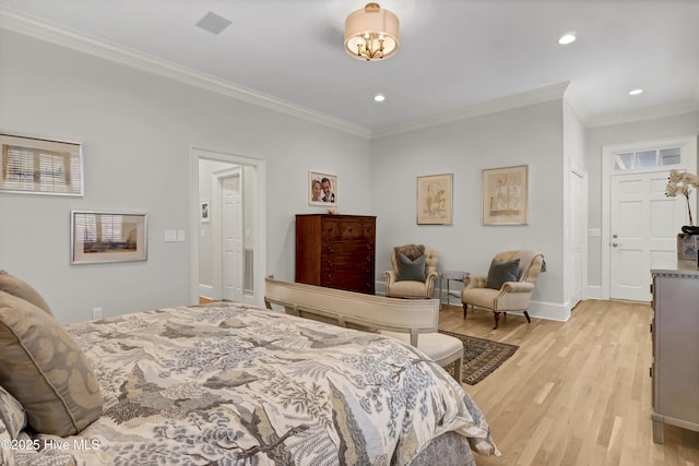 bedroom featuring ornamental molding and light hardwood / wood-style flooring