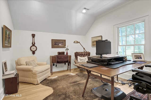 office space with lofted ceiling and light hardwood / wood-style floors