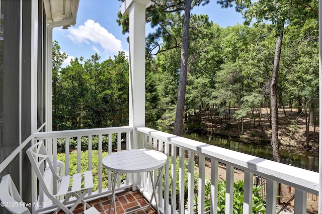 balcony featuring a water view