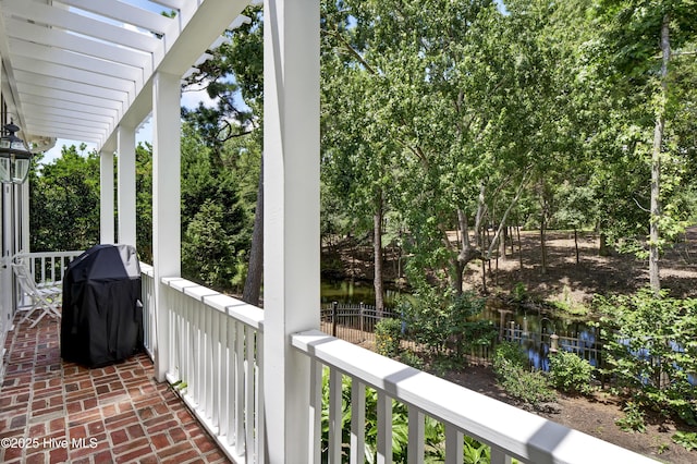 balcony featuring area for grilling and a pergola