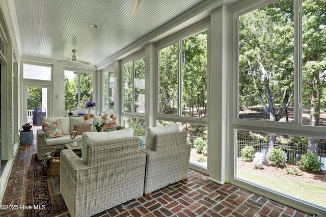 sunroom / solarium with ceiling fan