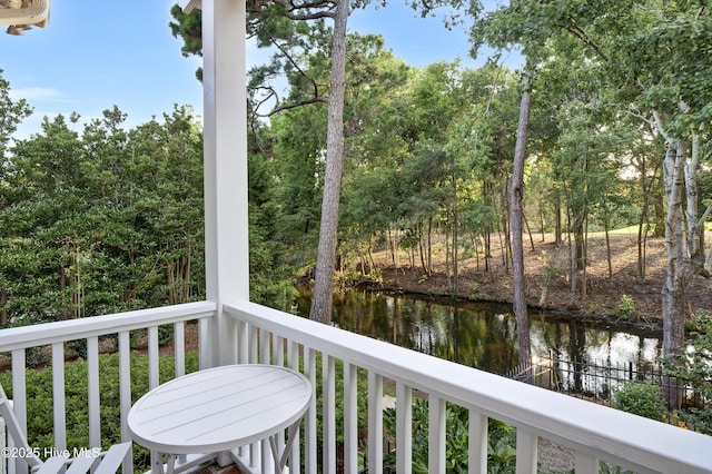 balcony featuring a water view