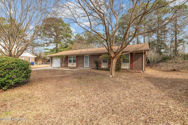 ranch-style house featuring a garage