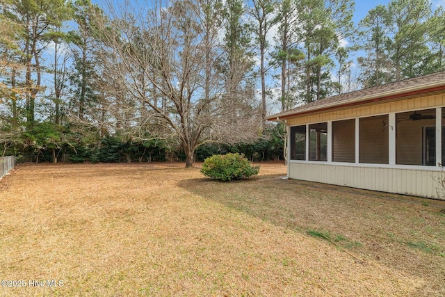 view of yard featuring a sunroom