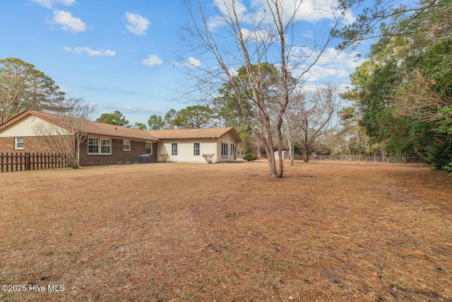 rear view of property featuring cooling unit