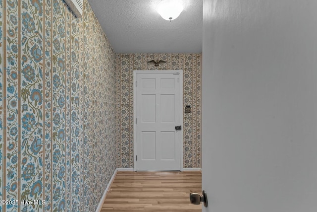 interior space featuring hardwood / wood-style floors and a textured ceiling