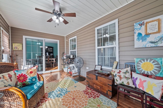 exterior space with outdoor lounge area and ceiling fan