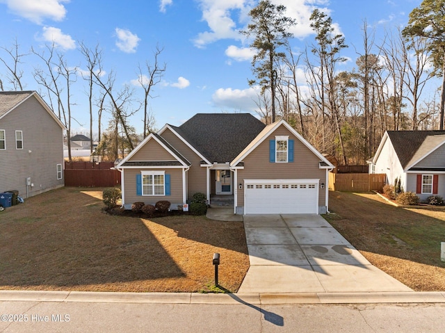 view of front of home with a garage and a front lawn