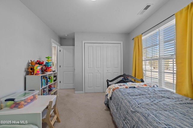 carpeted bedroom featuring a closet