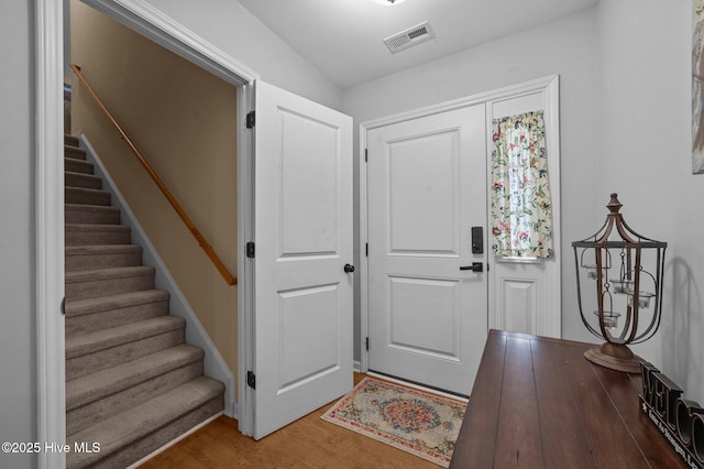 foyer entrance with hardwood / wood-style flooring