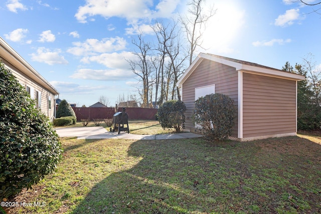 view of yard with a patio area and a storage unit