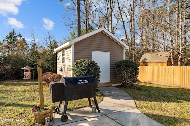 view of outbuilding with a yard