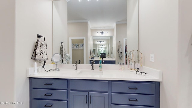 bathroom with vanity and crown molding